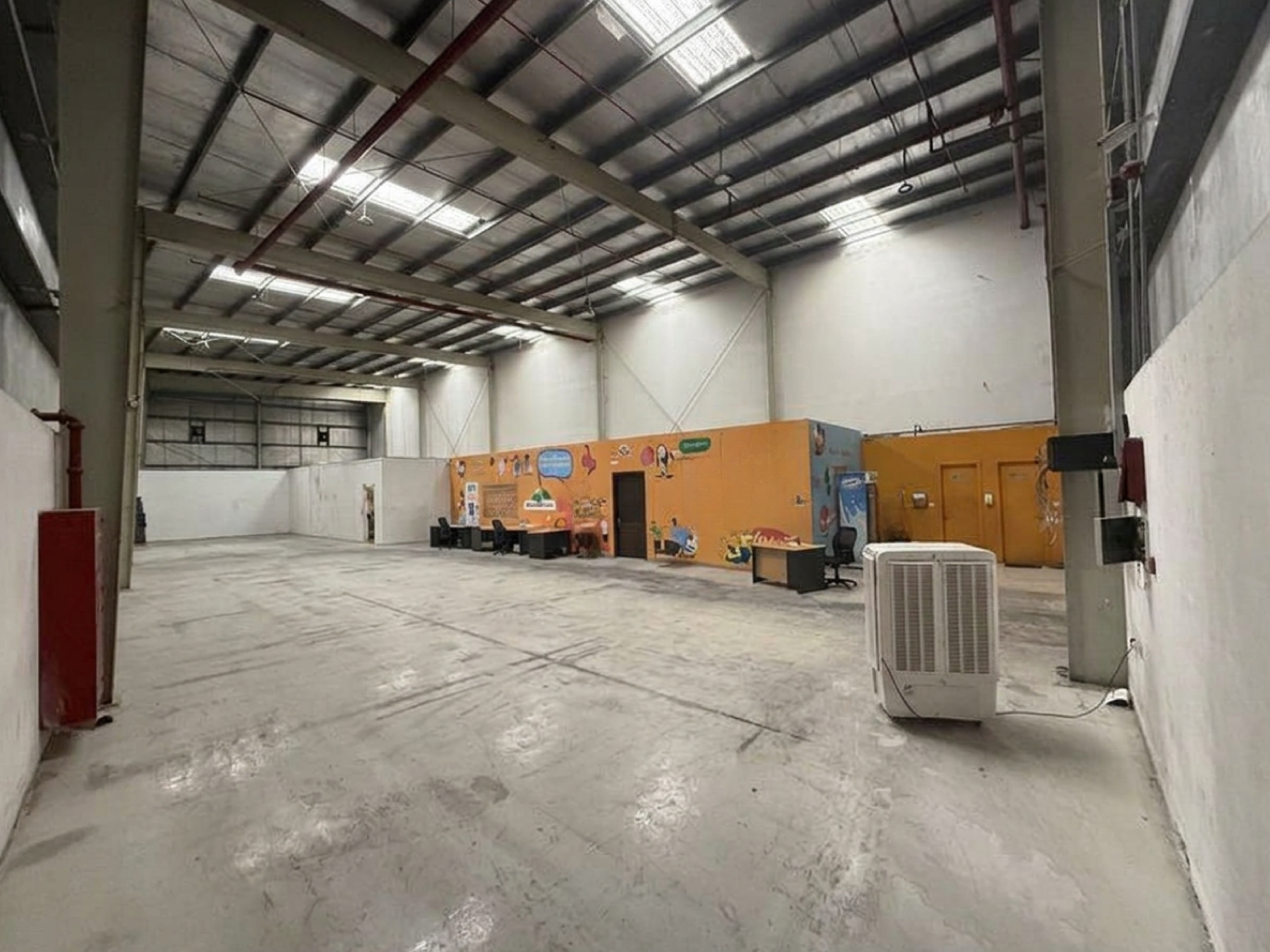 Warehouse for rent in Phase 2 at 423,750 AED per year
